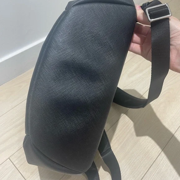 Tumi backpack in black leather